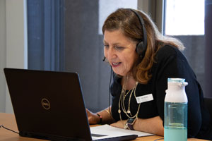 Workshop facilitator using a laptop