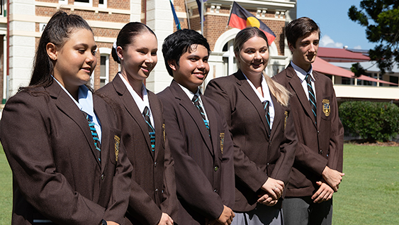 Students in their blazers outside
