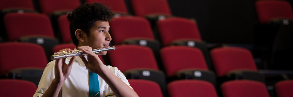 Student playing a flute